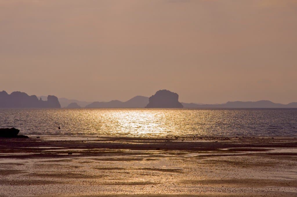 Soft sunset light over Klong Muang Beach with offshore islands on the Andaman Sea, Krabi